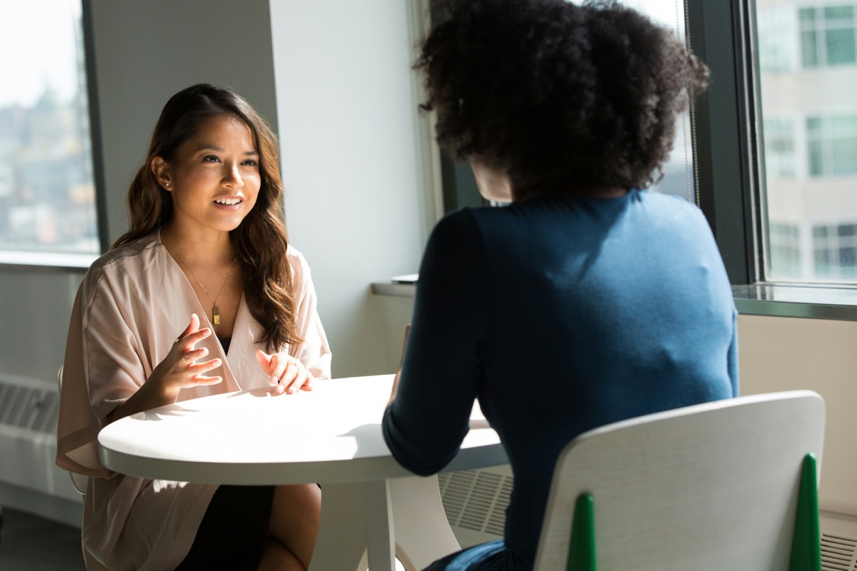 Practitioner in conversation with a client